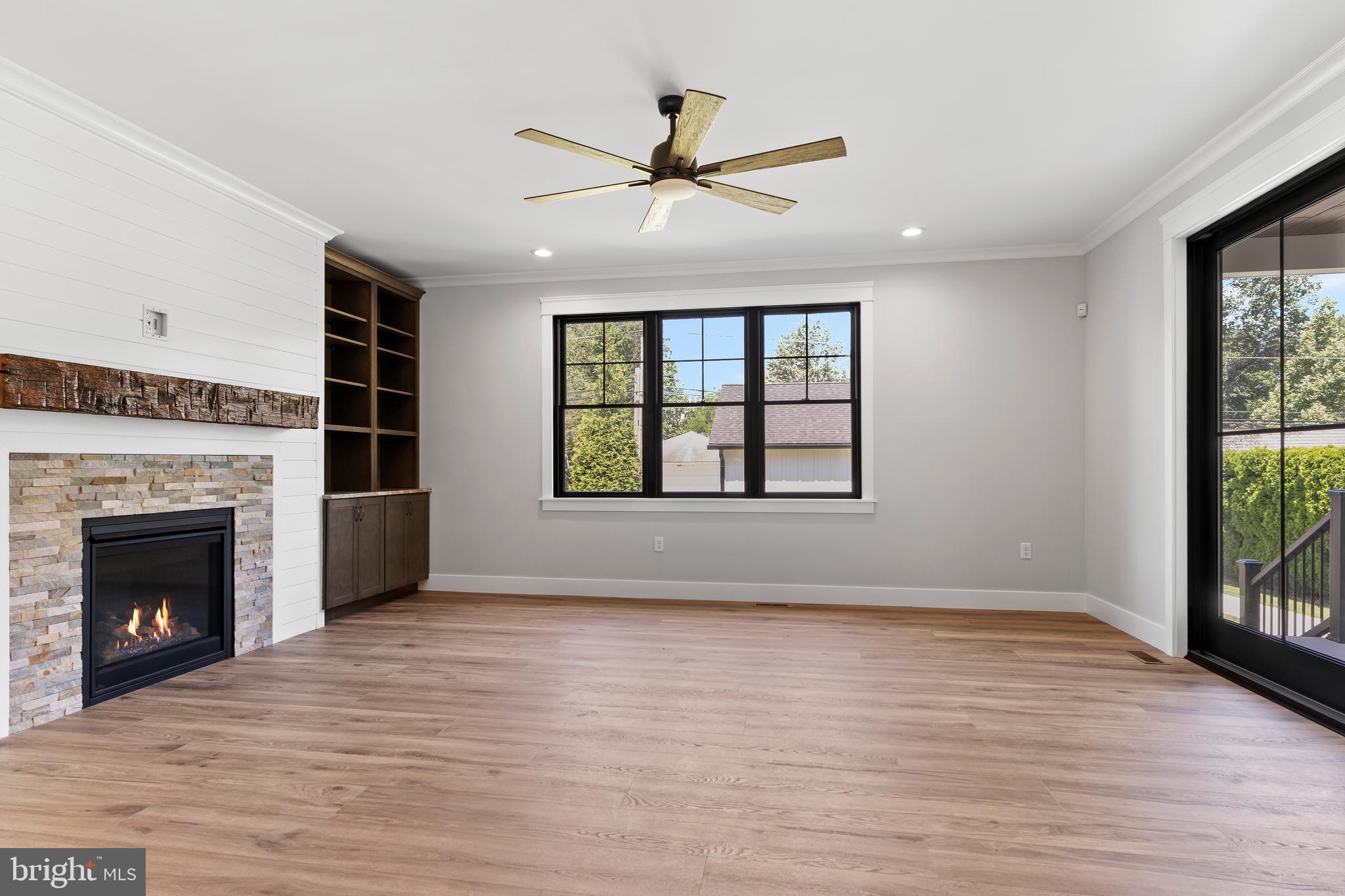 207 Maple Avenue Hershey, PA 17033 - Photo 25 of 79 wooden floor fireplace and windows in an empty room
