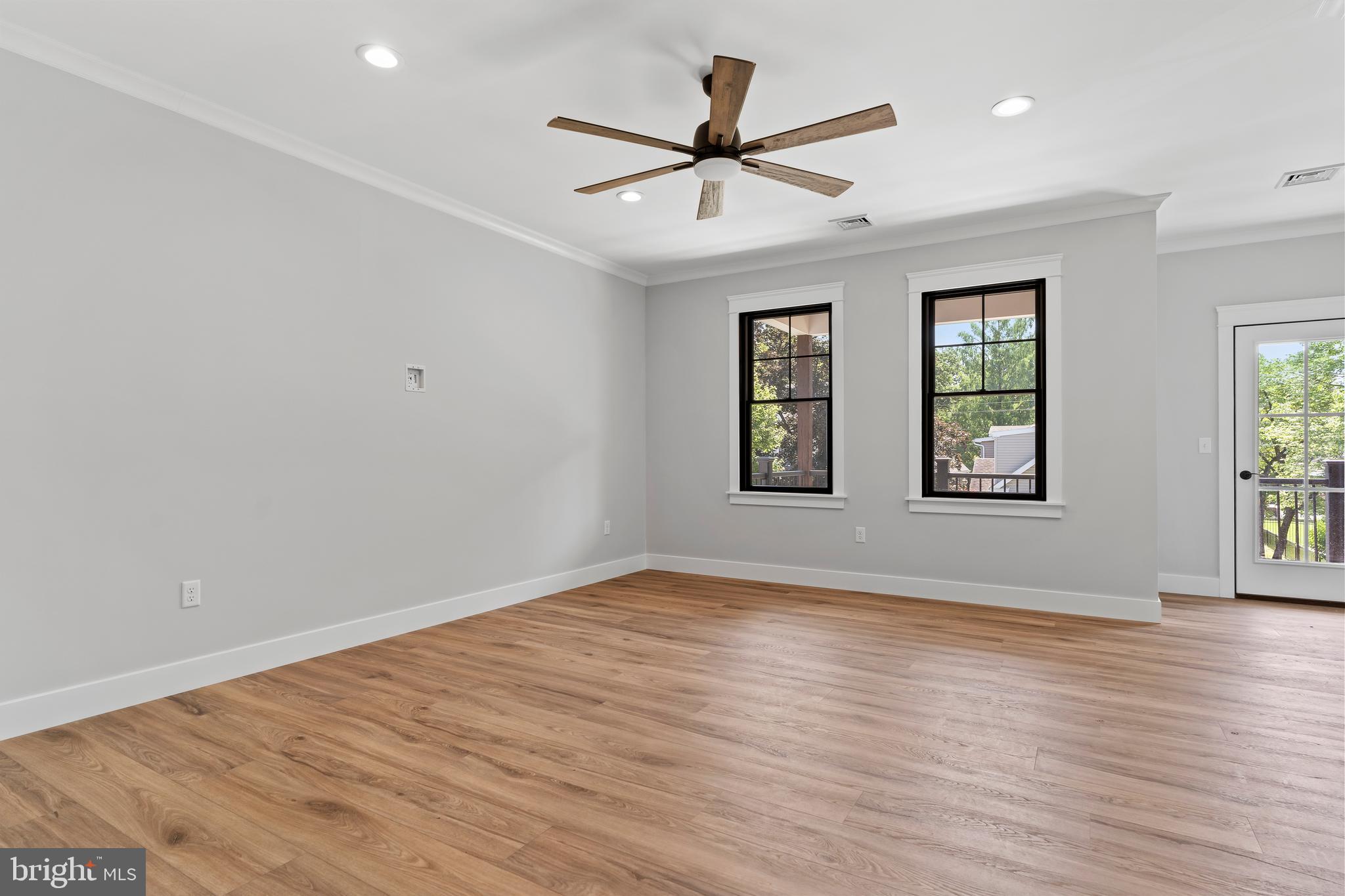 207 Maple Avenue Hershey, PA 17033 - Photo 39 of 79 an empty room with wooden floor fan and windows