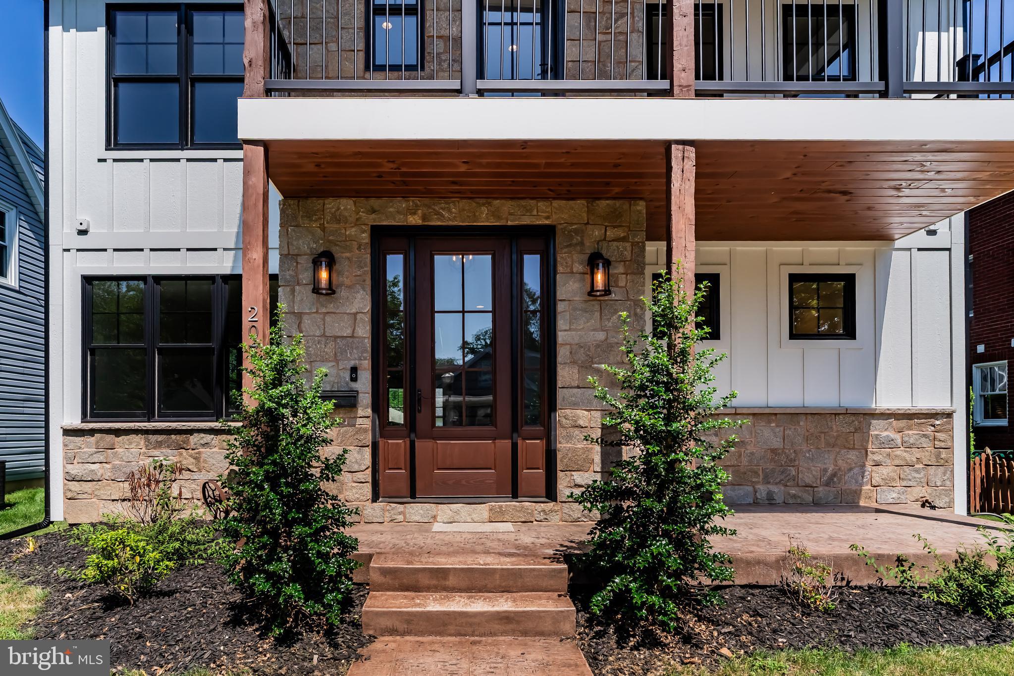 207 Maple Avenue Hershey, PA 17033 - Photo 4 of 79 a front view of a house with garden
