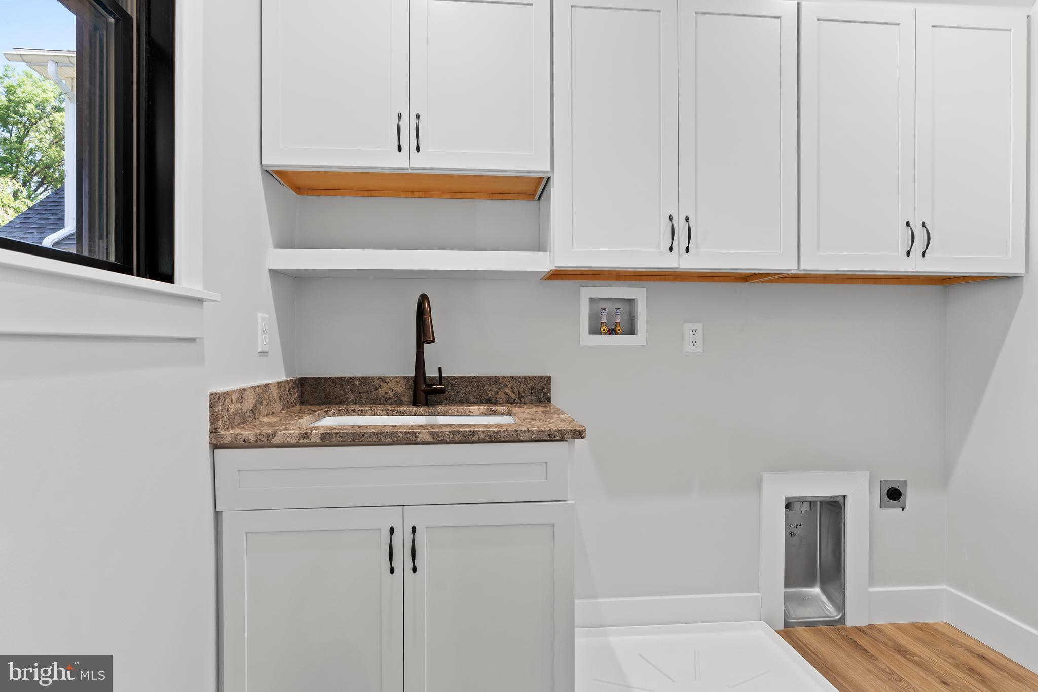 207 Maple Avenue Hershey, PA 17033 - Photo 47 of 79 a kitchen with granite countertop white cabinets and a sink
