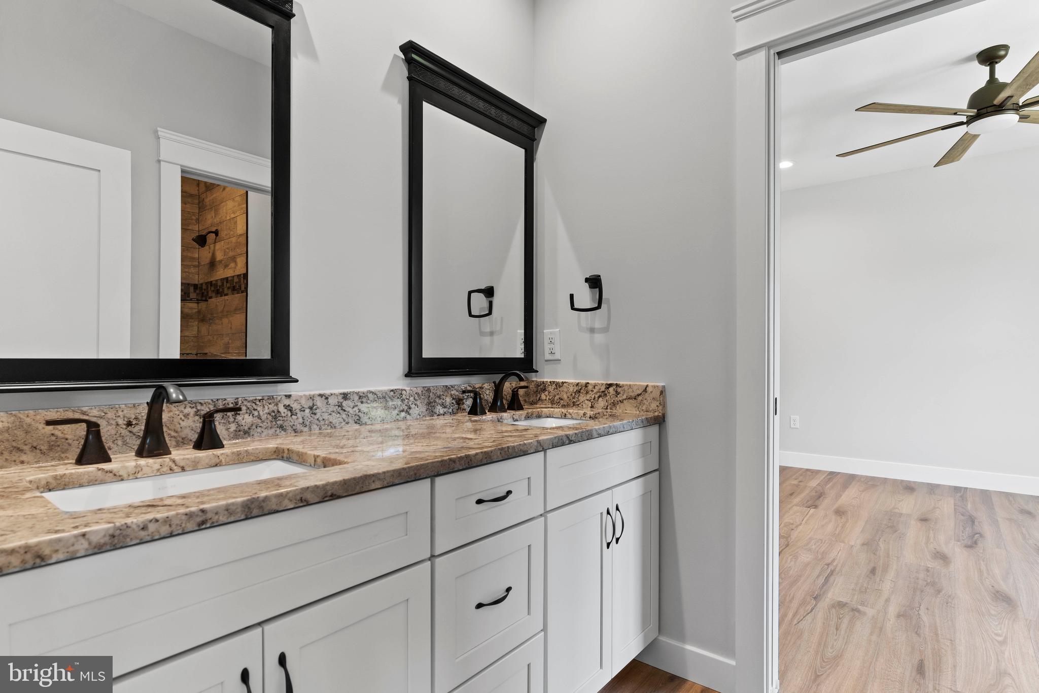 207 Maple Avenue Hershey, PA 17033 - Photo 57 of 79 a bathroom with a granite countertop sink and a mirror