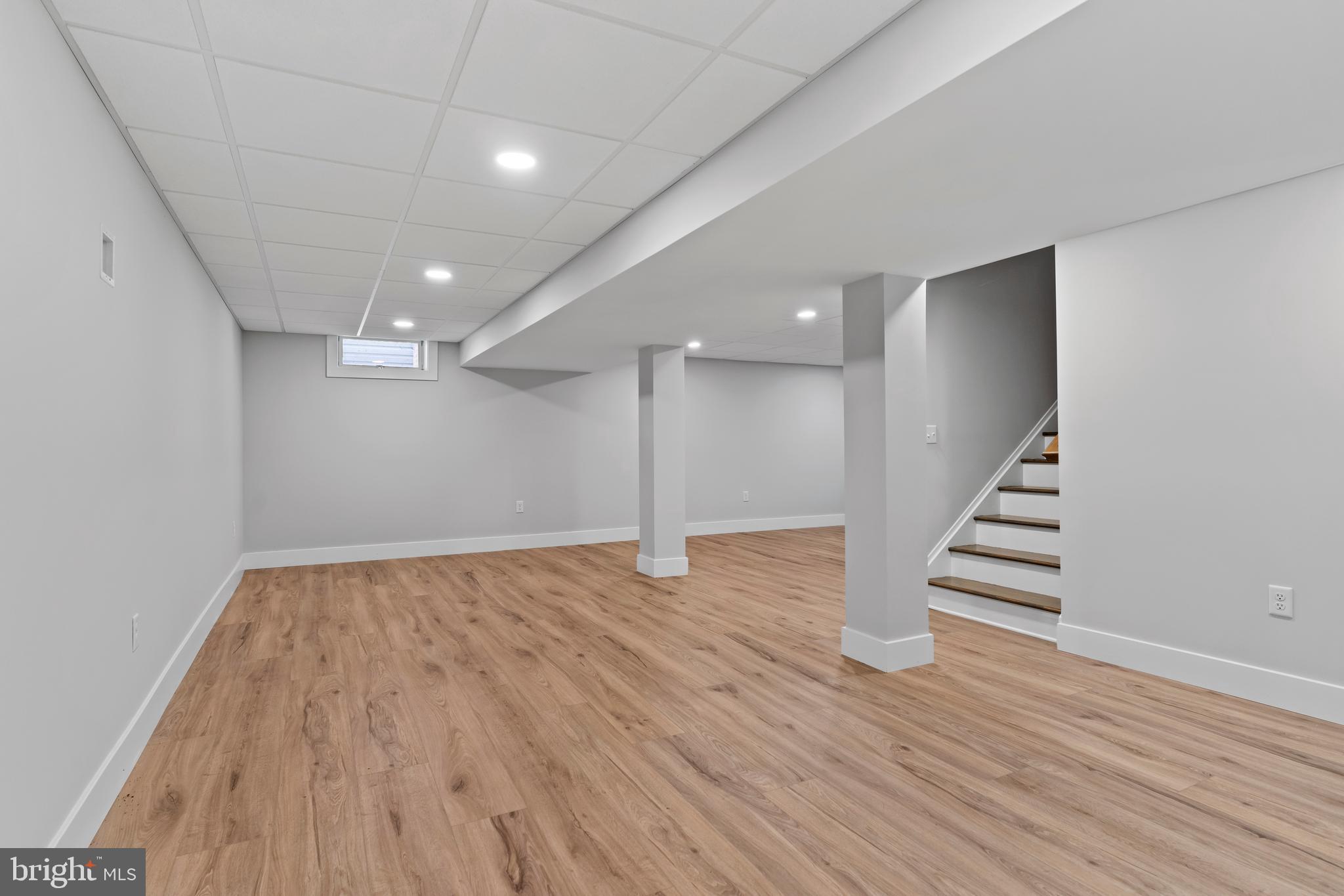 207 Maple Avenue Hershey, PA 17033 - Photo 64 of 79 a view of an empty room with wooden floor and stairs