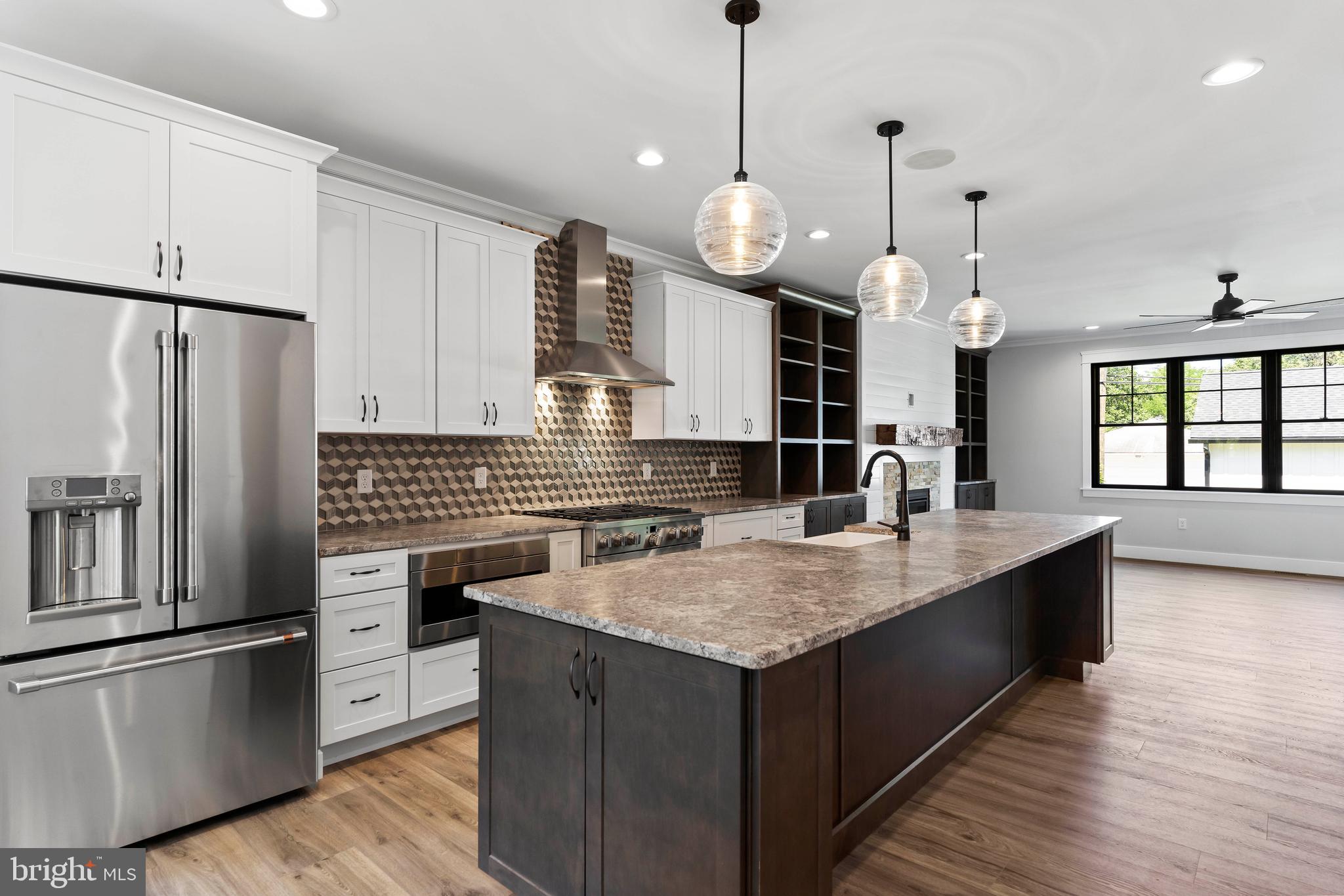 207 Maple Avenue Hershey, PA 17033 - Photo 10 of 79 a kitchen with stainless steel appliances granite countertop a sink a stove and a refrigerator