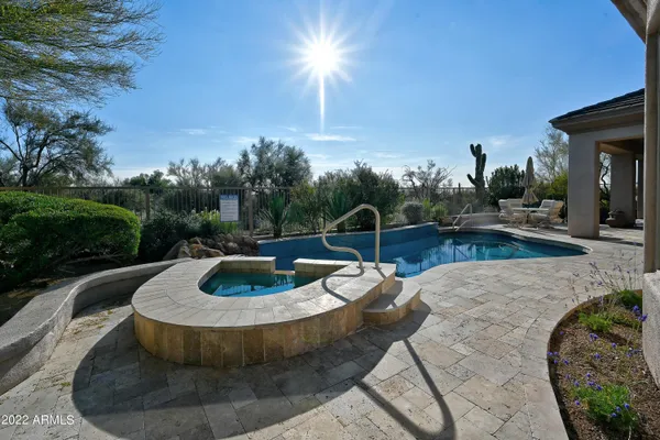 a view of a swimming pool with a yard