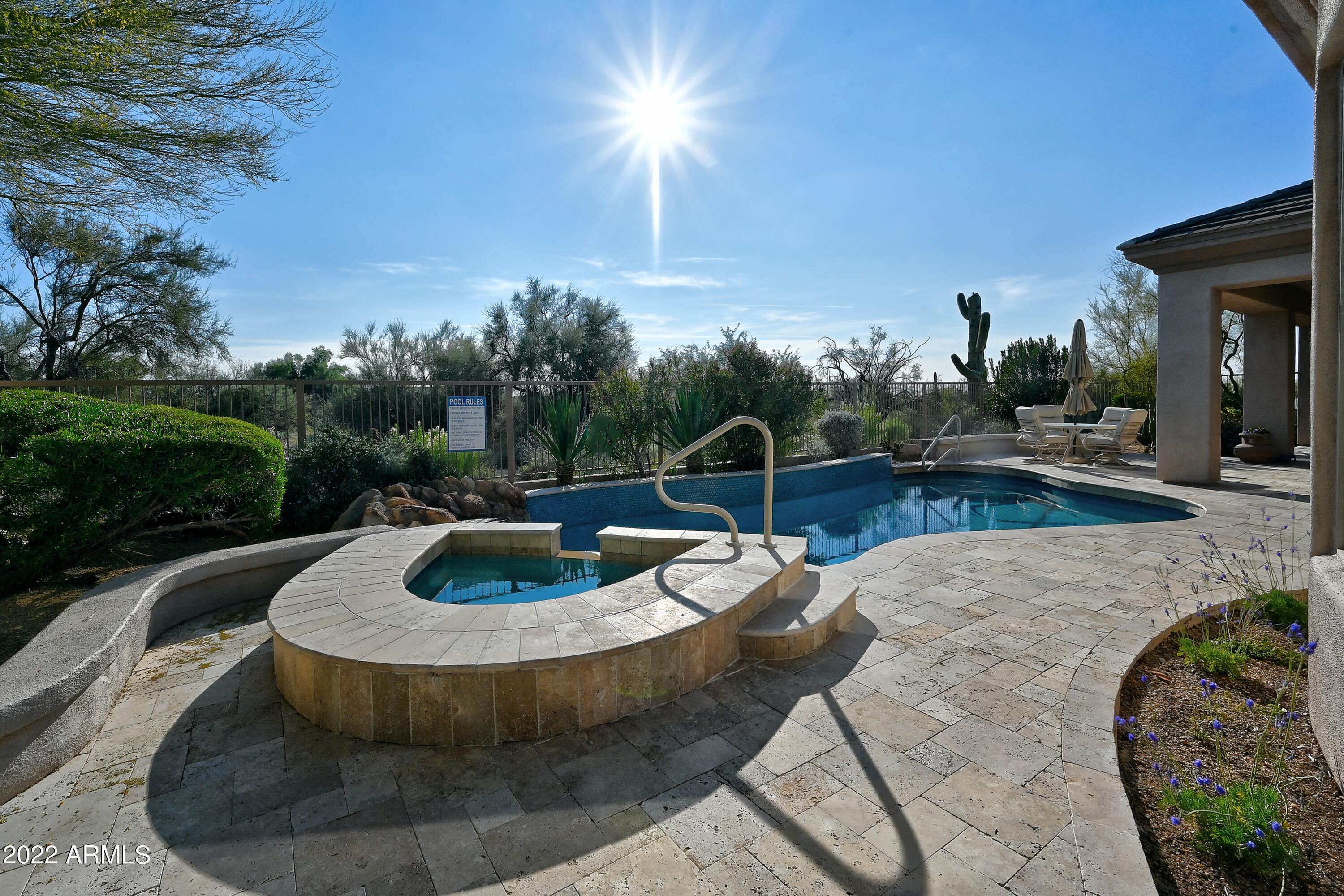 a view of a swimming pool with a yard