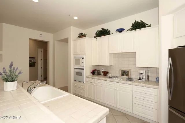 a bed room with a bed and a television