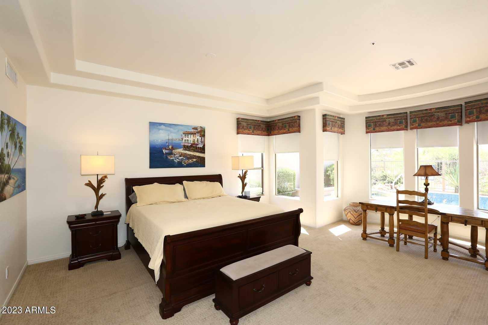 6335 East Marioca Circle Scottsdale, AZ 85266 - Photo 18 of 66 a bedroom with a bed and a large window