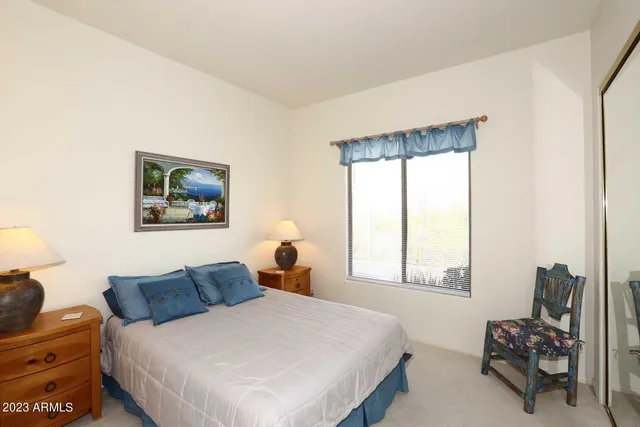 a building outdoor space with patio furniture and potted plants