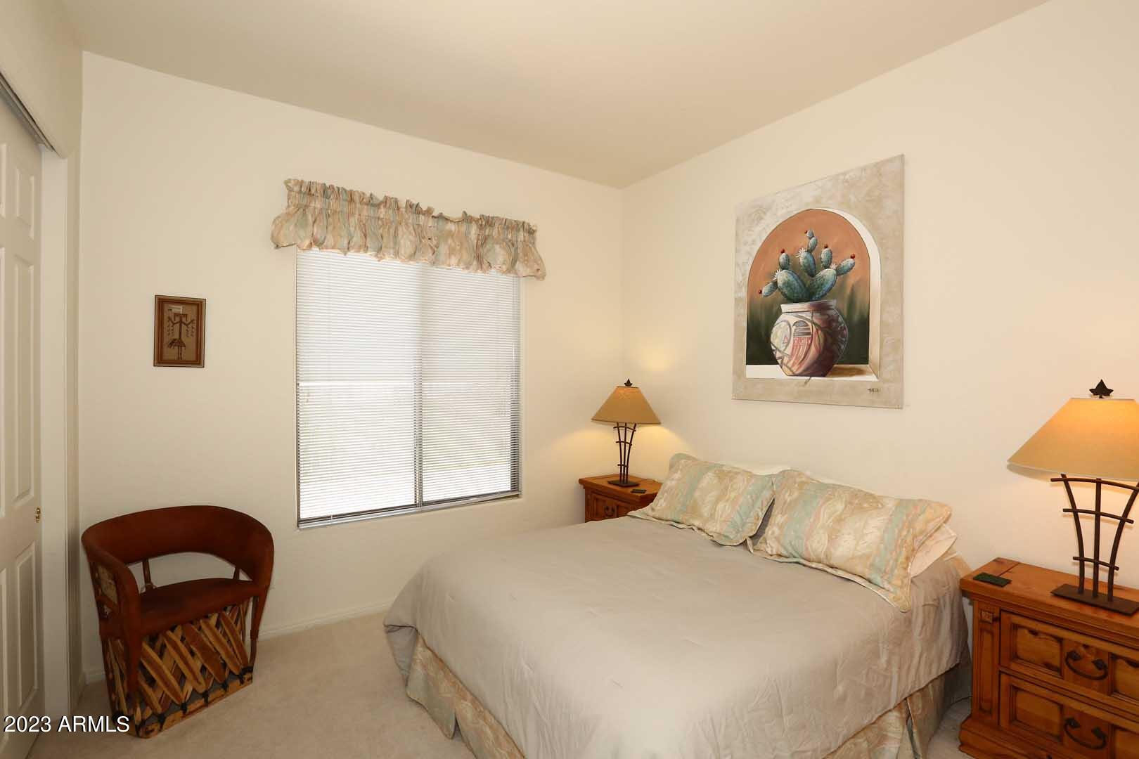 6335 East Marioca Circle Scottsdale, AZ 85266 - Photo 29 of 66 a bedroom with a bed and a painting on the wall