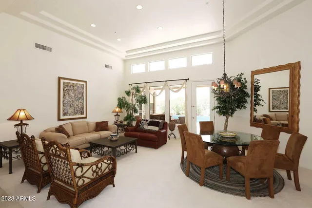 a living room with furniture or couch and a large window