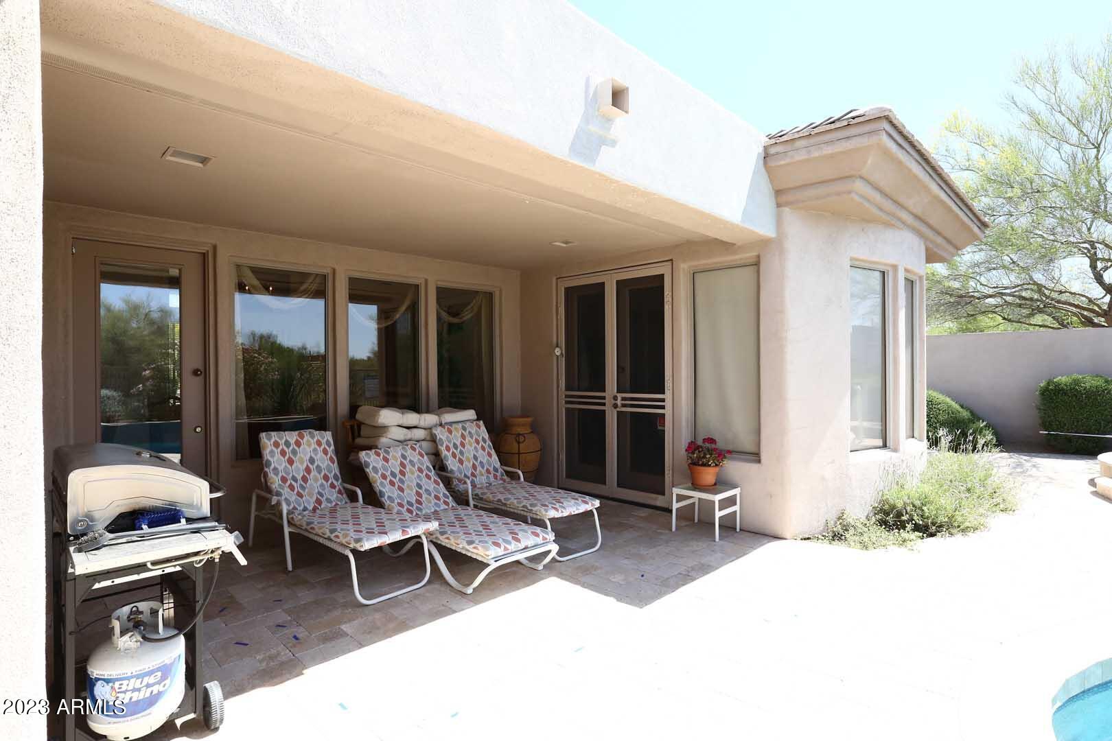 6335 East Marioca Circle Scottsdale, AZ 85266 - Photo 38 of 66 a building outdoor space with patio furniture and potted plants