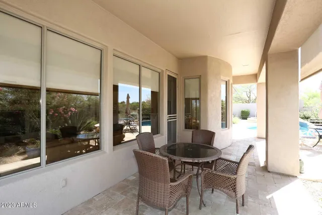 a view of swimming pool with a yard and seating area