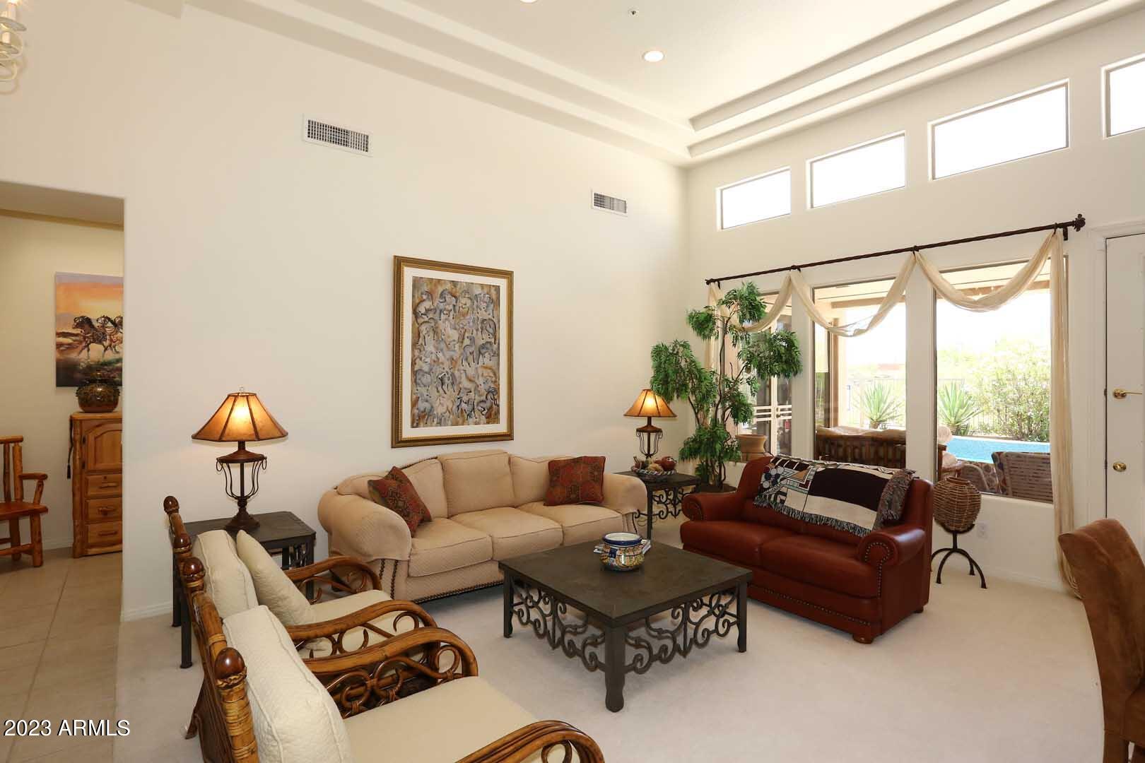 6335 East Marioca Circle Scottsdale, AZ 85266 - Photo 4 of 66 a living room with furniture and a large window
