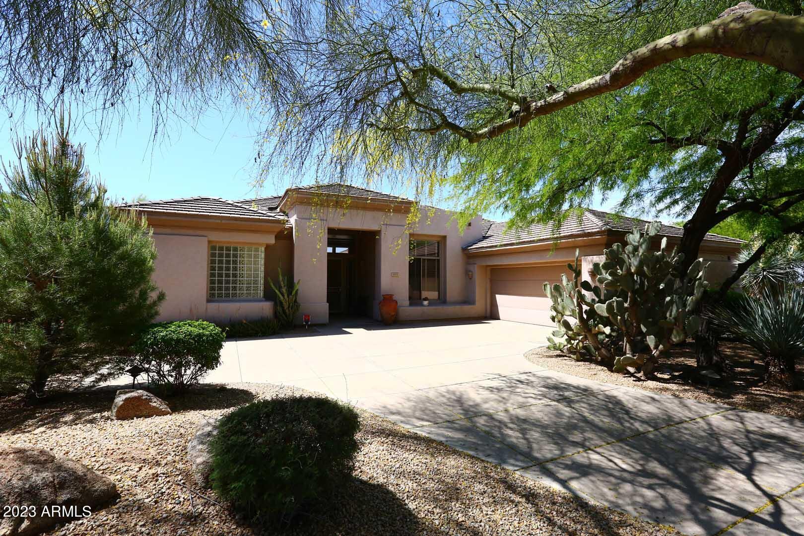 6335 East Marioca Circle Scottsdale, AZ 85266 - Photo 42 of 66 a front view of a house with a yard