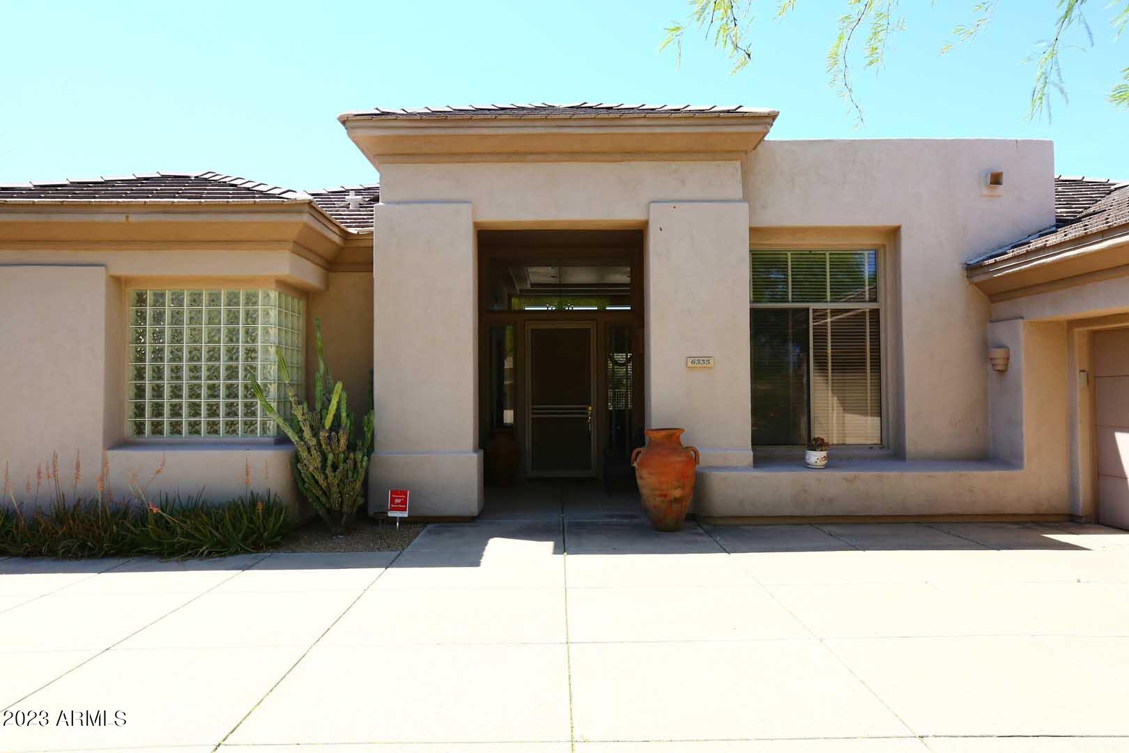 6335 East Marioca Circle Scottsdale, AZ 85266 - Photo 43 of 66 a front view of a house with a garage