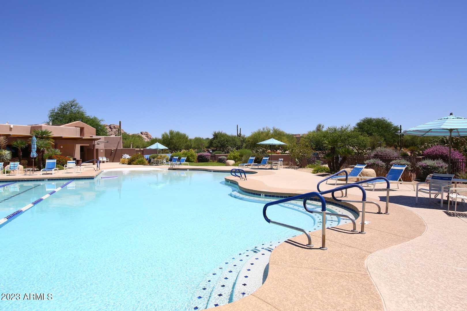 6335 East Marioca Circle Scottsdale, AZ 85266 - Photo 51 of 66 a swimming pool with outdoor seating and city view