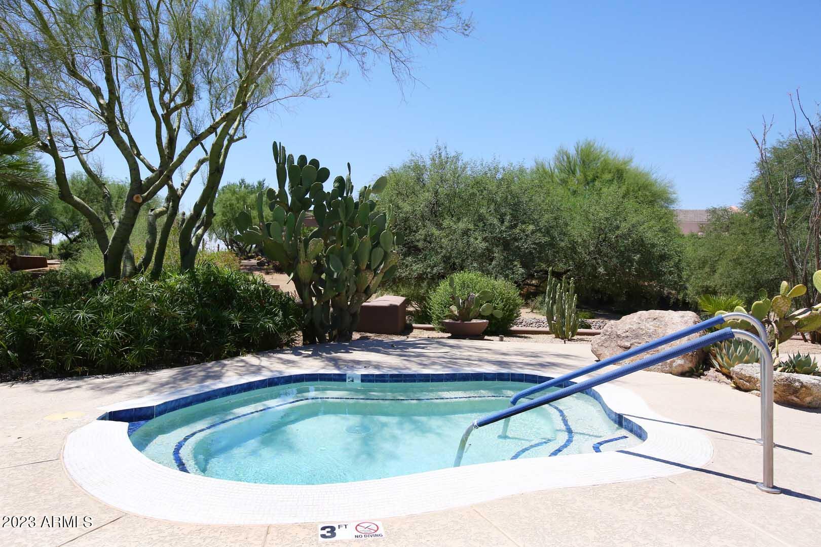 6335 East Marioca Circle Scottsdale, AZ 85266 - Photo 53 of 66 a view of swimming pool with a yard and seating area