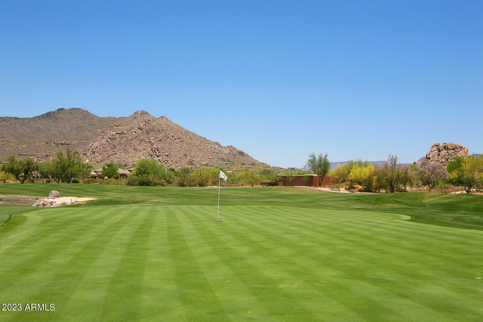 6335 East Marioca Circle Scottsdale, AZ 85266 - Photo 60 of 66 a view of a grassy field with an trees