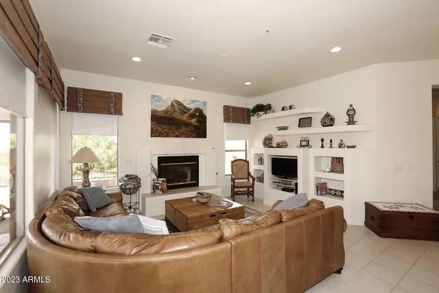 a large kitchen with a table and chairs