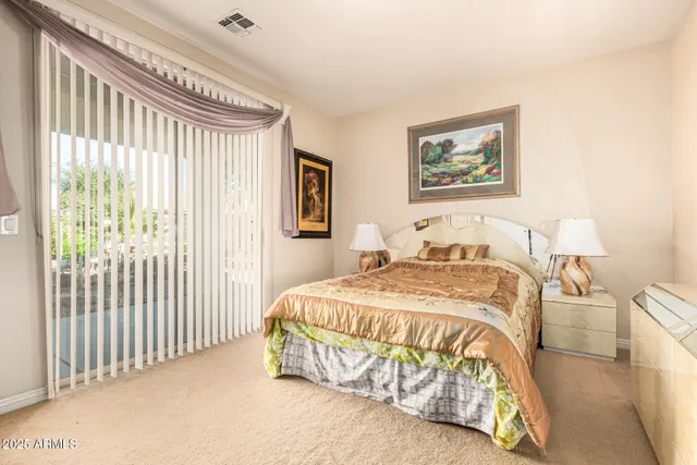 a bedroom with a bed and a table