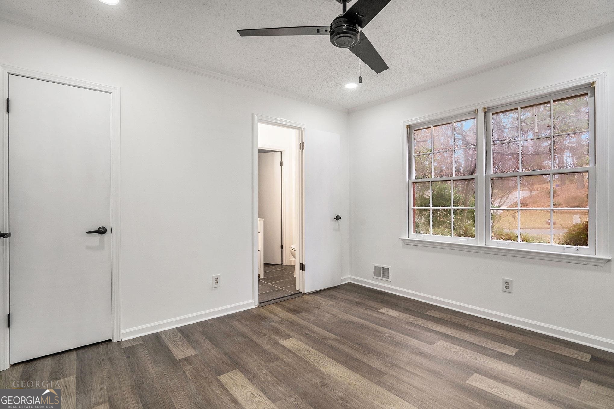 3343 Spring Meadow Court Tucker, GA 30084 - Photo 16 of 24 a view of empty room with wooden floor and fan