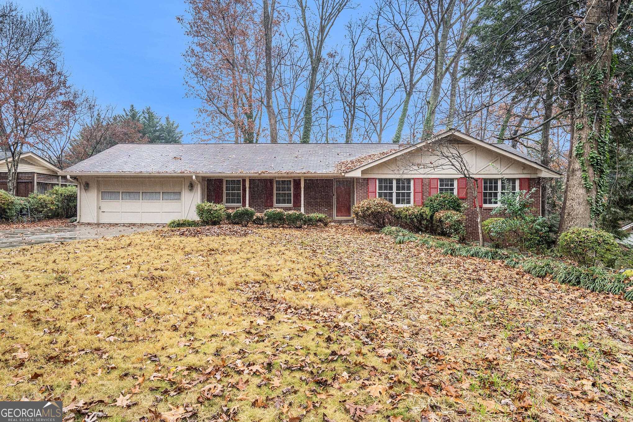 3343 Spring Meadow Court Tucker, GA 30084 - Photo 2 of 24 a front view of a house with a garden