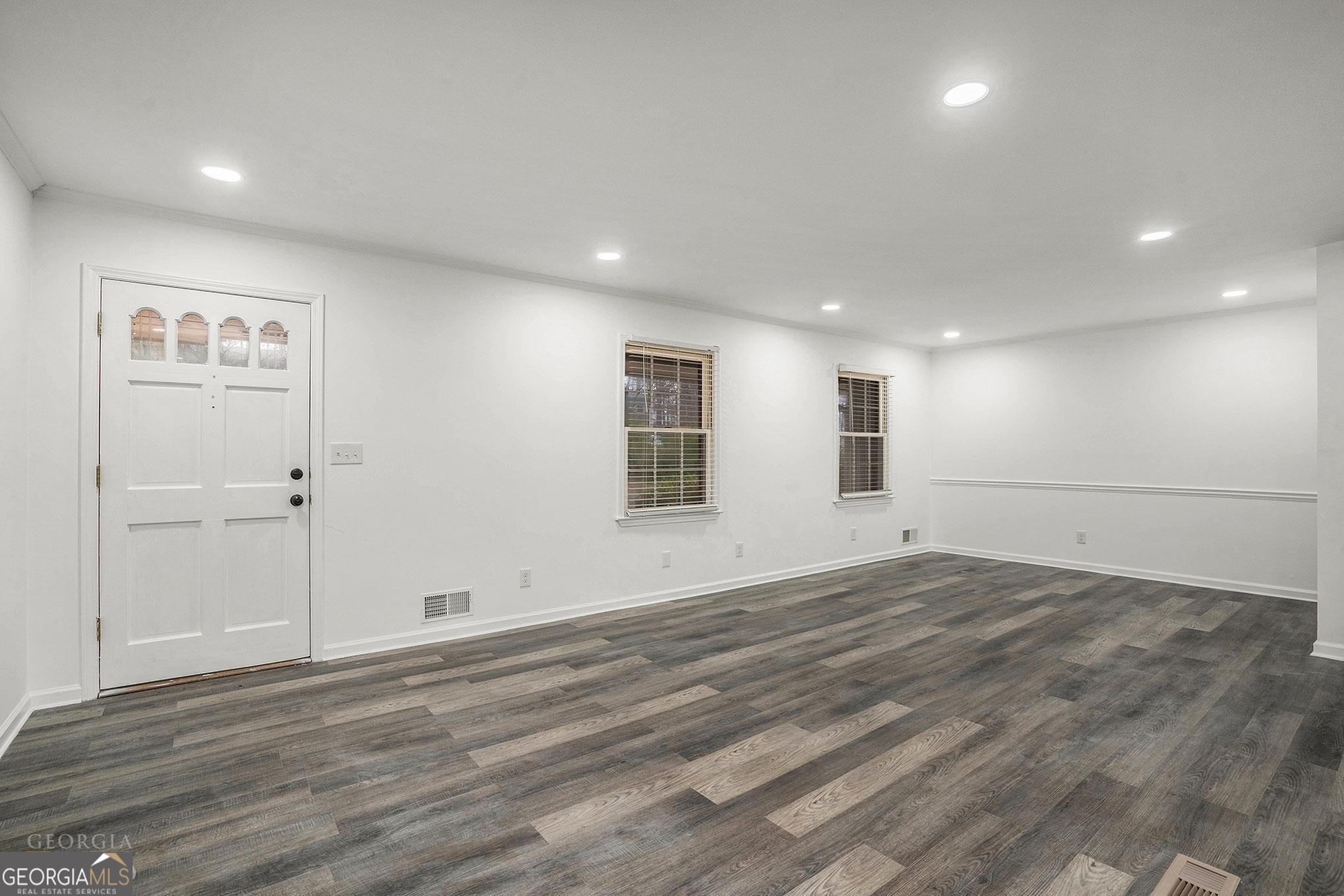 3343 Spring Meadow Court Tucker, GA 30084 - Photo 4 of 24 an empty room with wooden floor and windows