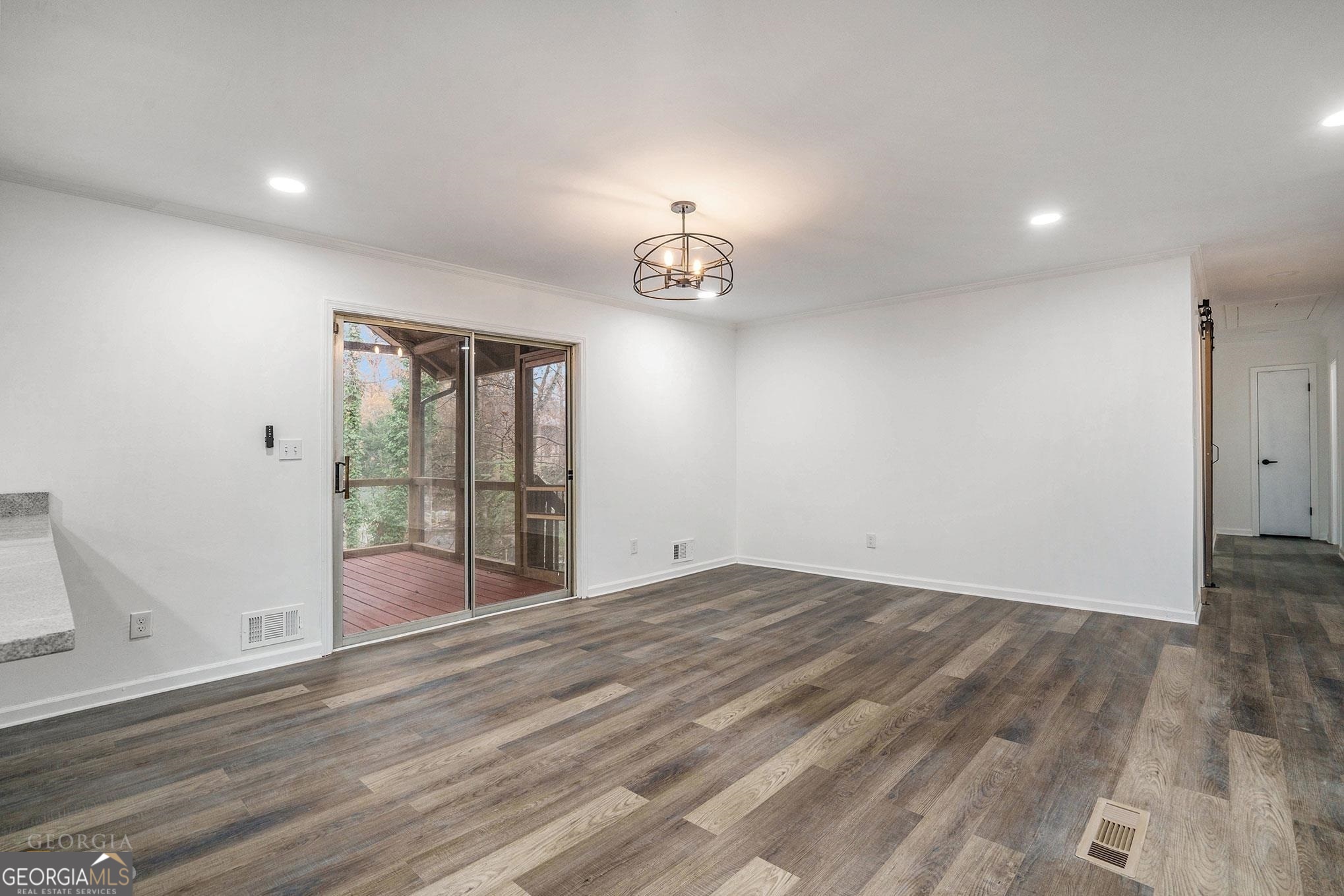 3343 Spring Meadow Court Tucker, GA 30084 - Photo 7 of 24 wooden floor in an empty room with a window