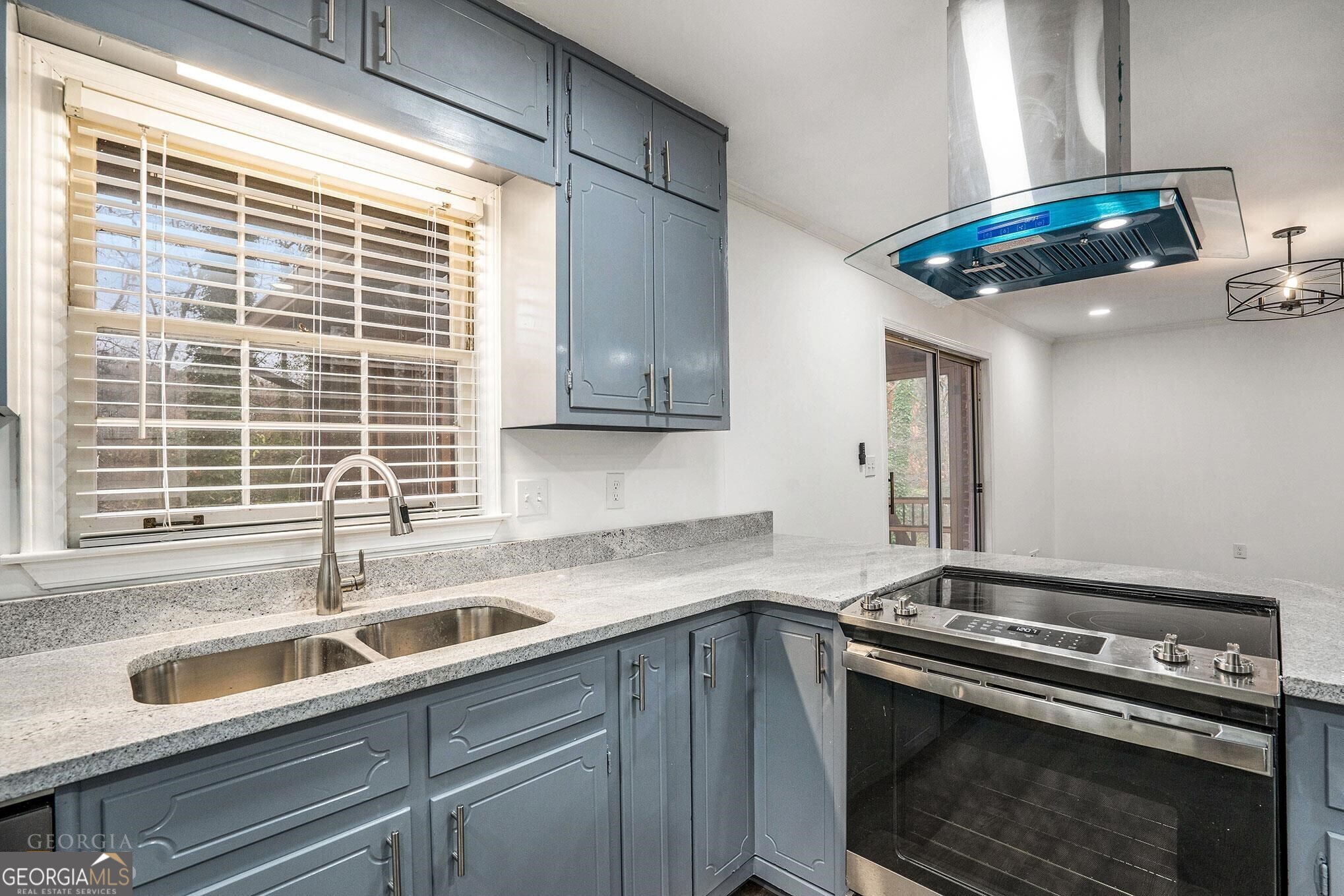 3343 Spring Meadow Court Tucker, GA 30084 - Photo 9 of 24 a kitchen with stainless steel appliances a sink a stove and a window