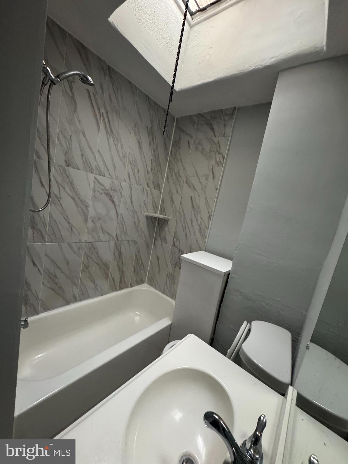 841 Bridge Street Philadelphia, PA 19124 - Photo 8 of 11 a bathroom with a toilet and bathtub