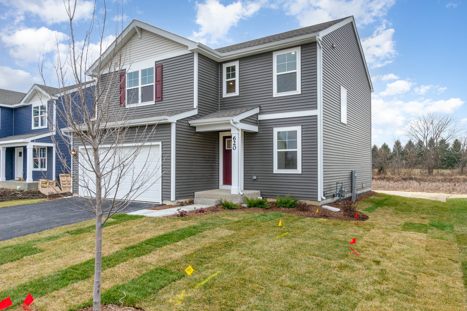 620 Ensign Place Hebron, IN 46341 - Photo 3 of 19 a view of a house with backyard and a tree