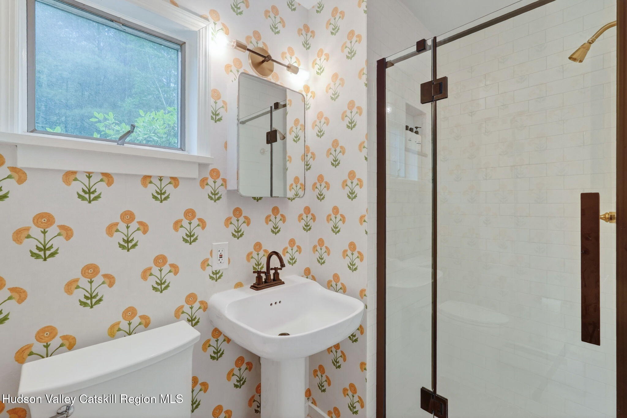 52 Aster Road Olivebridge, NY 12461 - Photo 16 of 23 a bathroom with a sink a mirror and a shower