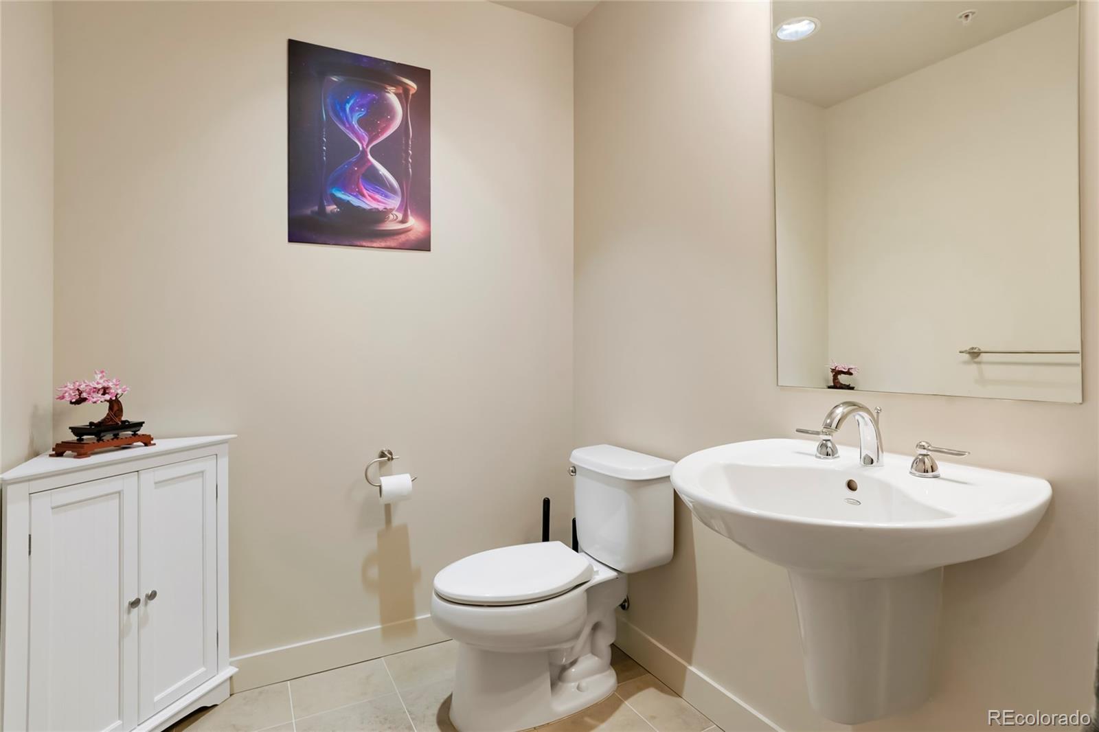 2229 Blake Street, Unit 505 Denver, CO 80205 - Photo 16 of 28 a bathroom with a sink and mirror