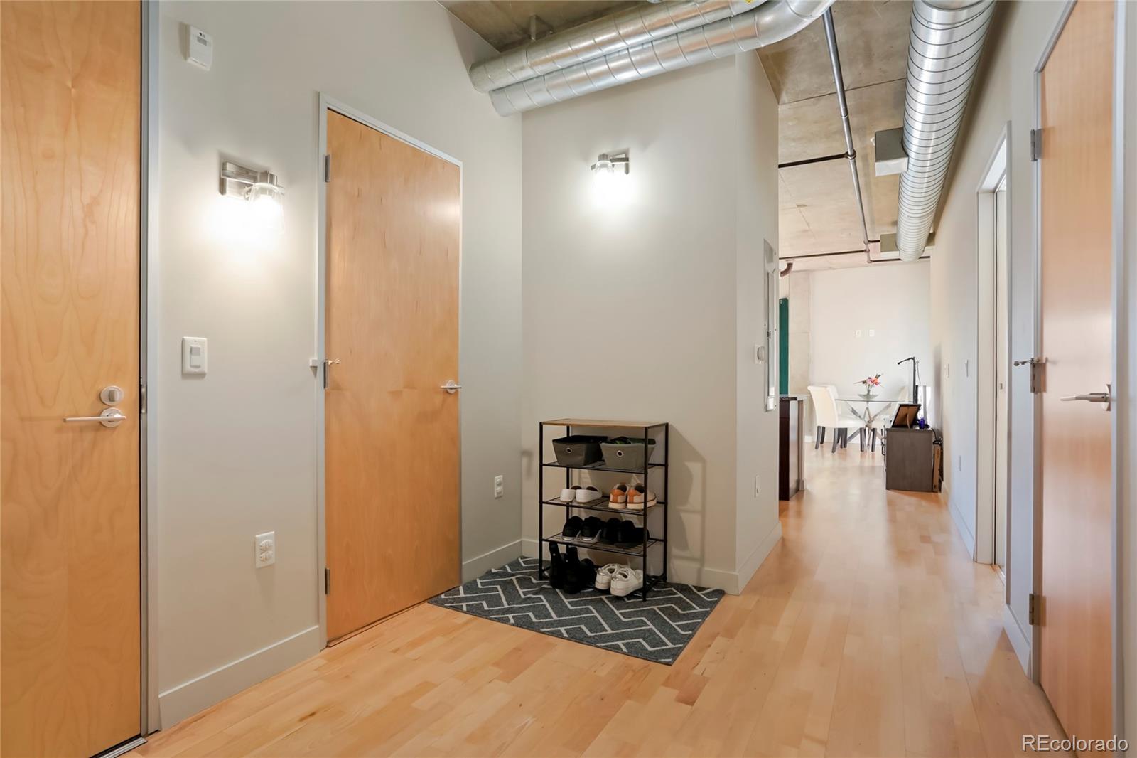 2229 Blake Street, Unit 505 Denver, CO 80205 - Photo 17 of 28 a hallway with a view of living room