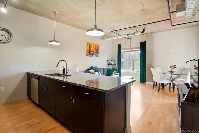 a bedroom with a bed wooden floor and a desk