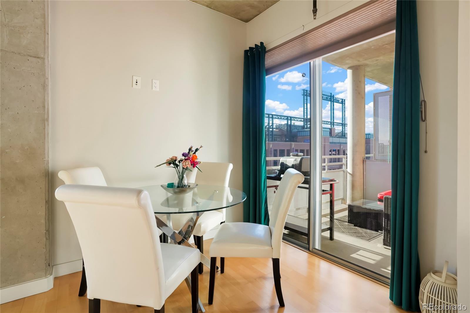 2229 Blake Street, Unit 505 Denver, CO 80205 - Photo 9 of 28 a dining room with furniture and window