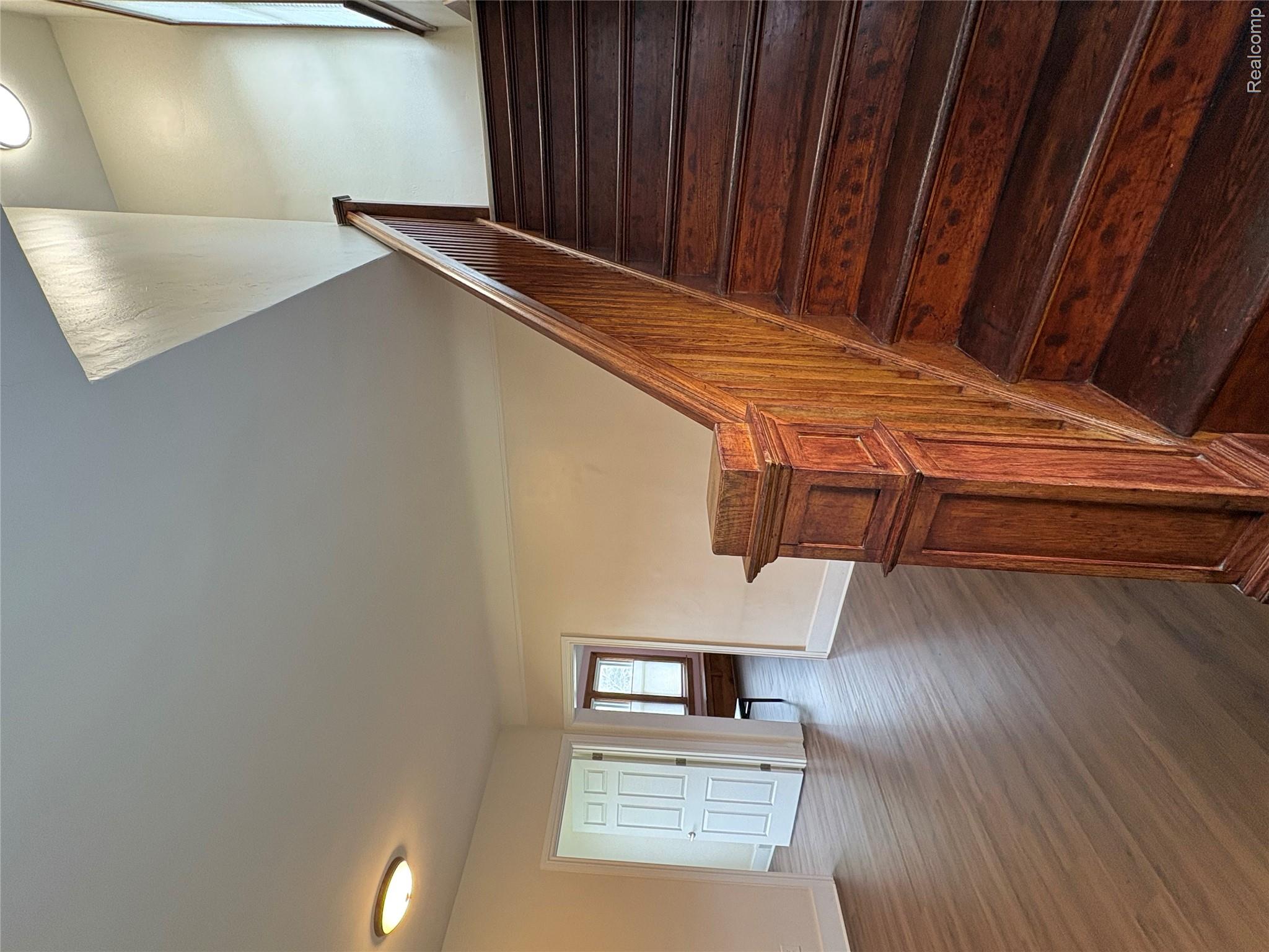 2175 West Auburn Road Rochester, MI 48309 - Photo 8 of 30 Staircase featuring wood finished floors and baseboards