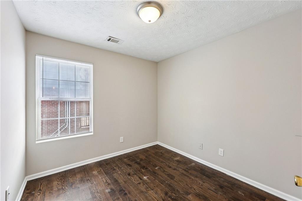 122 Nowell Street Monroe, GA 30655 - Photo 16 of 24 an empty room with windows