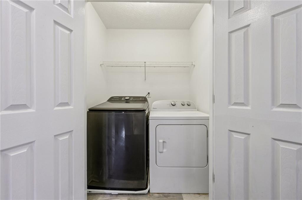 122 Nowell Street Monroe, GA 30655 - Photo 21 of 24 a utility room with dryer and washer