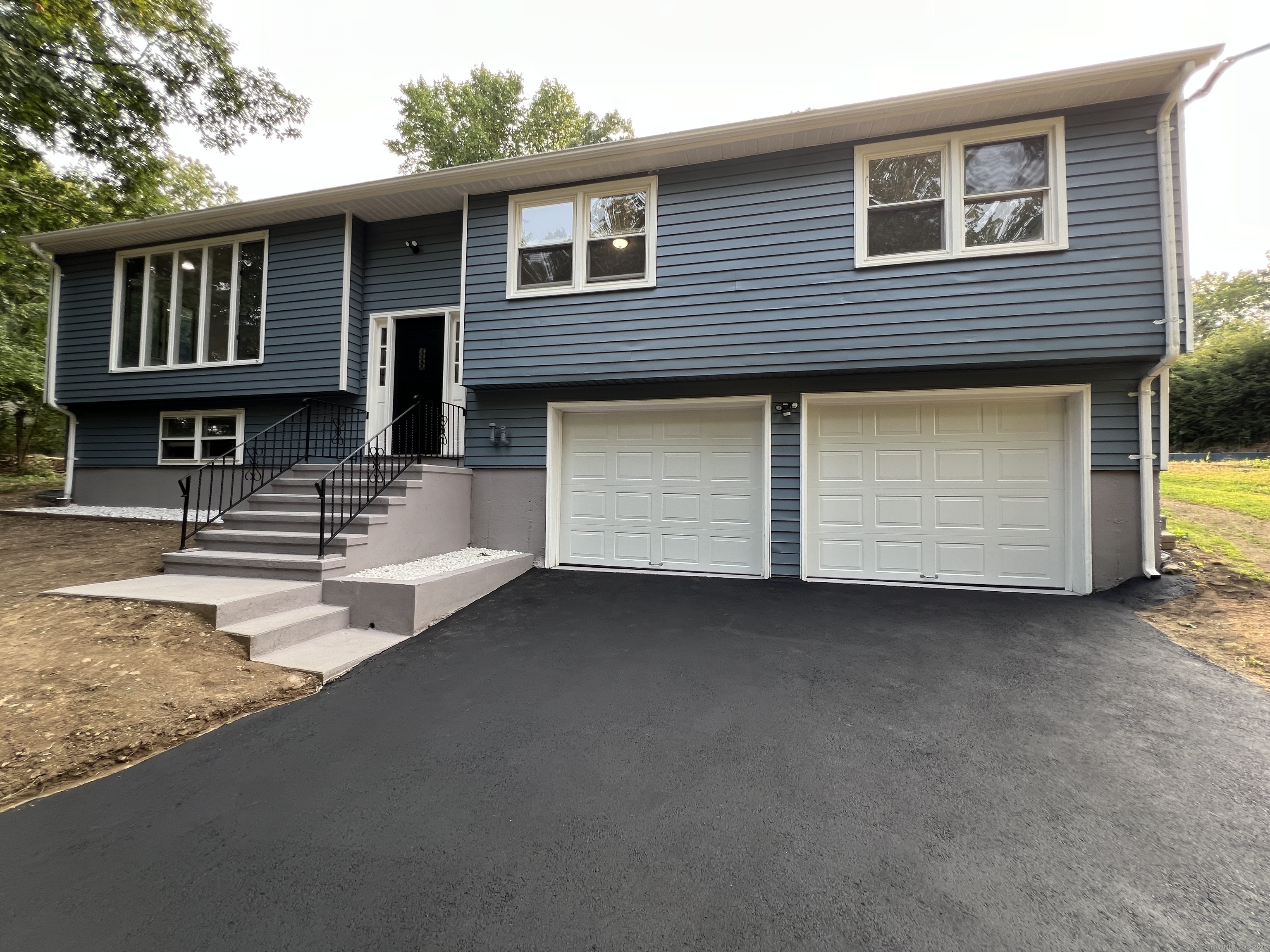 26 Finch Road Wolcott, CT 06716 - Photo 1 of 1 a view of a house with backyard