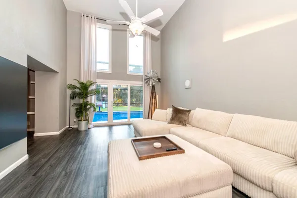 a living room with furniture and a large window