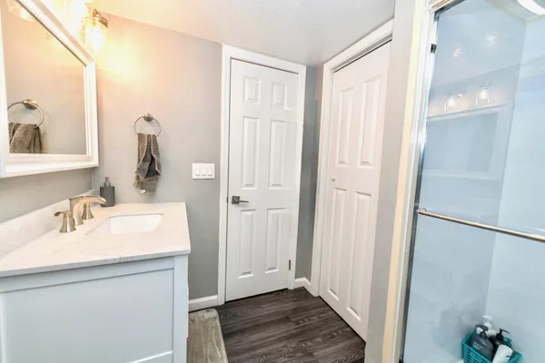 a bathroom with a sink and a mirror