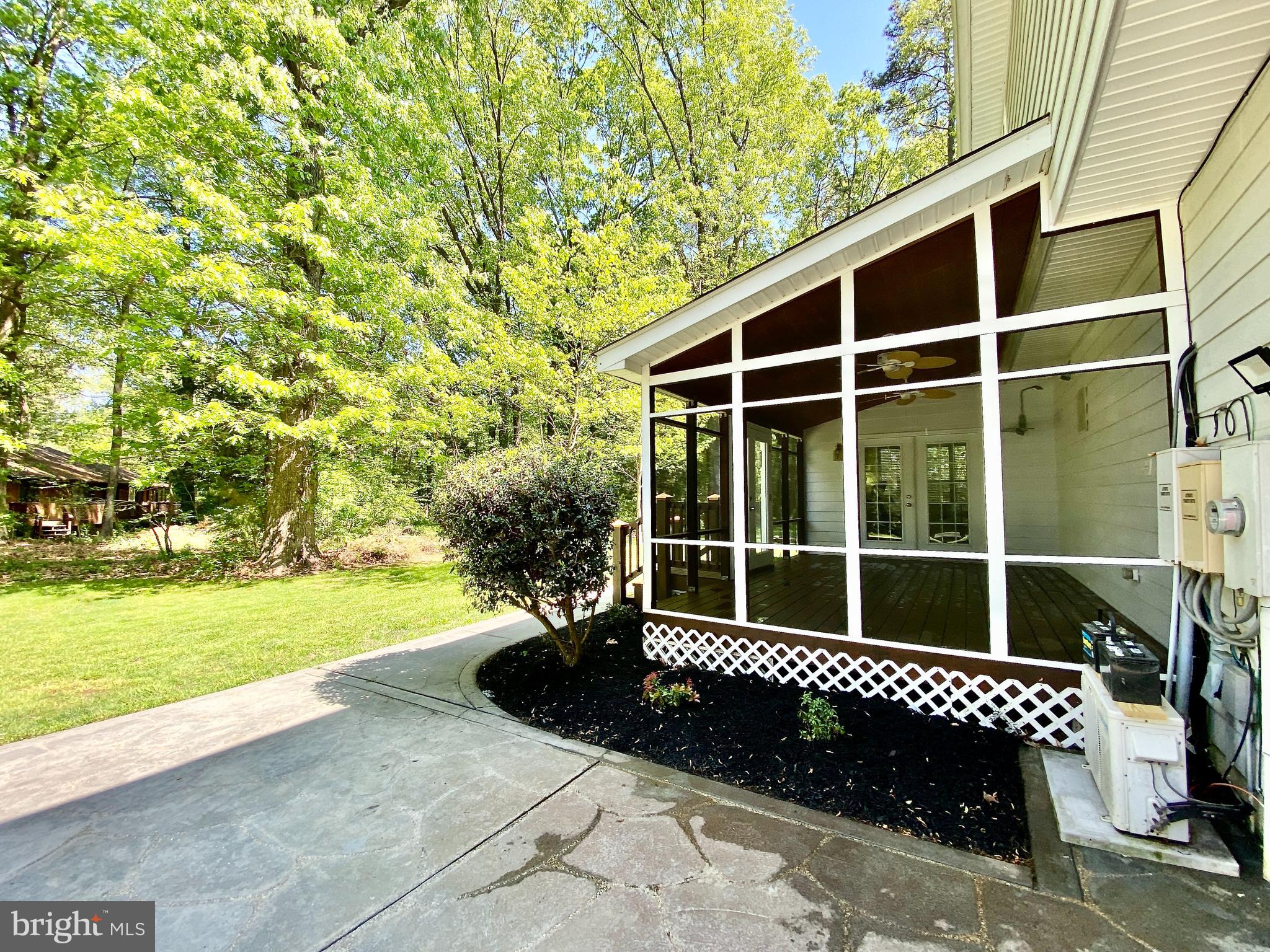 14550 Ivy Dale Court Swan Point, MD 20645 - Photo 23 of 48 Stamped concrete patio off screened in porch