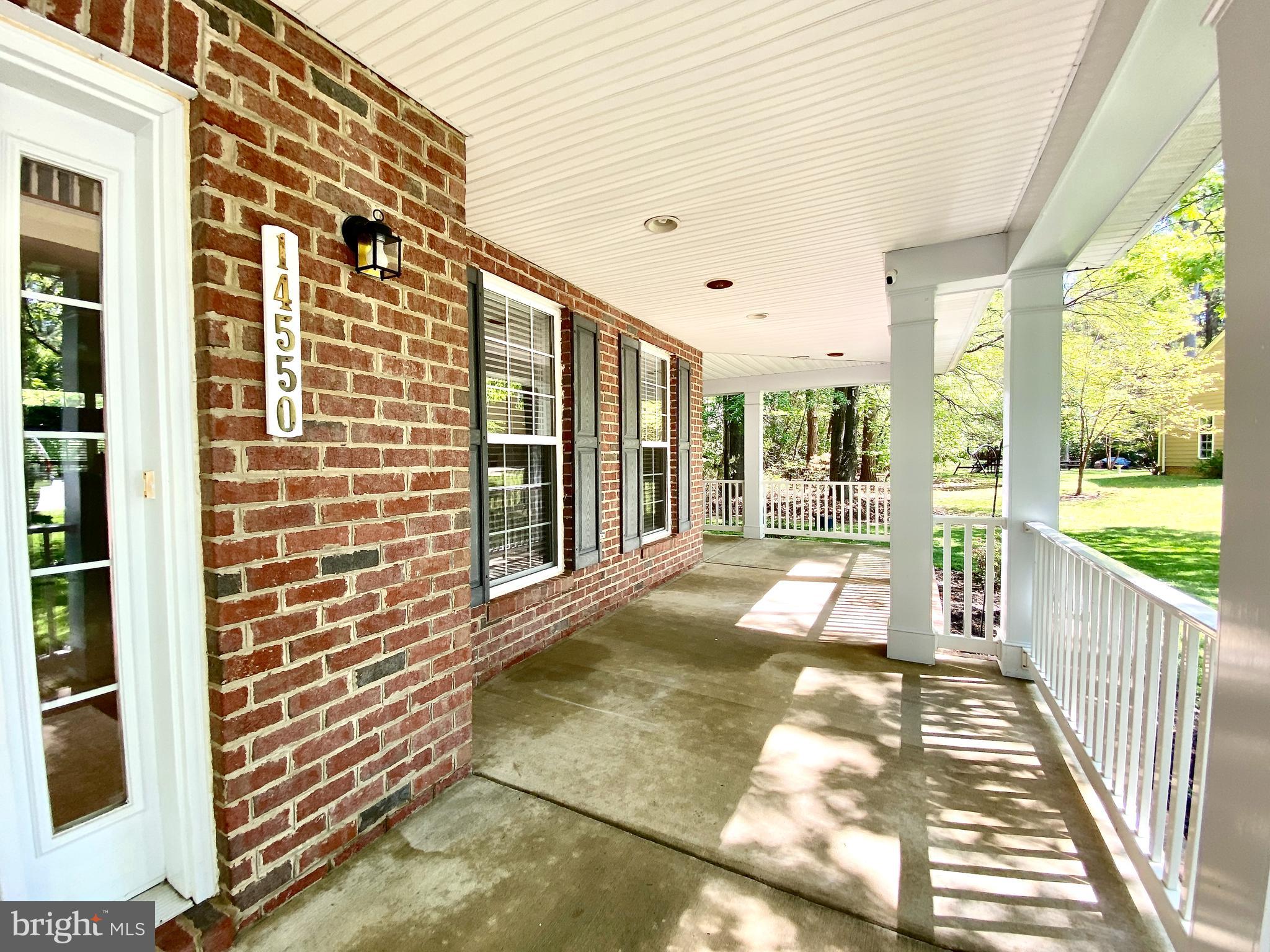 14550 Ivy Dale Court Swan Point, MD 20645 - Photo 26 of 48 Wrap around porch