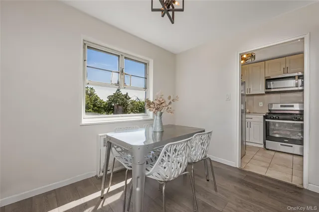 a dining room with furniture and window
