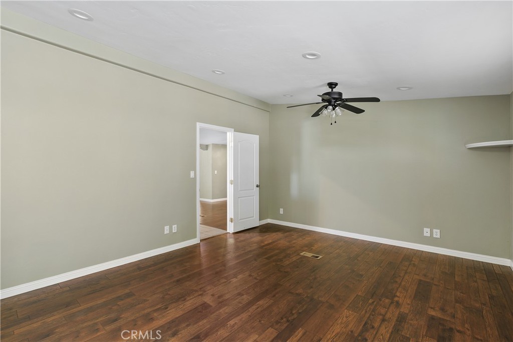 23742 Bundy Canyon Road Wildomar, CA 92595 - Photo 13 of 38 a view of a room with wooden floor