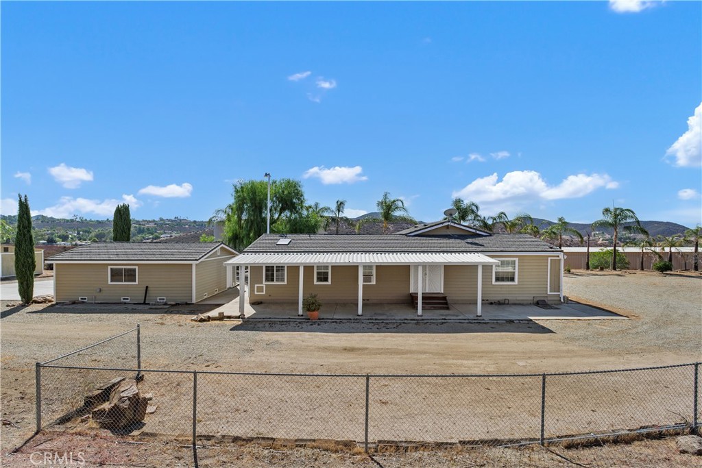 23742 Bundy Canyon Road Wildomar, CA 92595 - Photo 27 of 38 a front view of a house with a yard