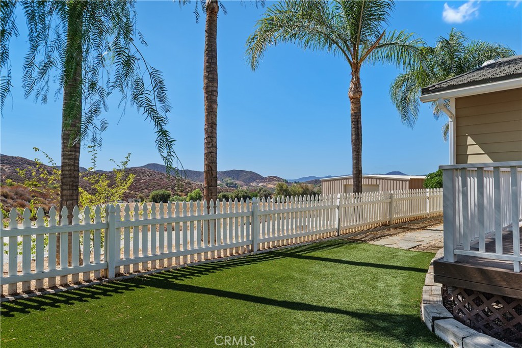 23742 Bundy Canyon Road Wildomar, CA 92595 - Photo 3 of 38 a view of a backyard with a garden