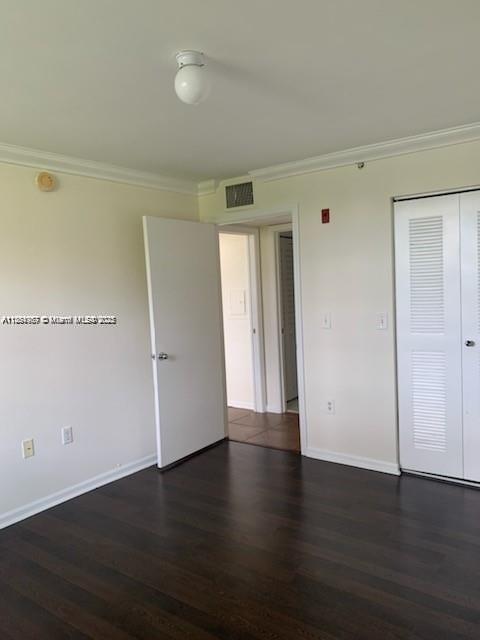 2071 Renaissance Boulevard, Unit 108 Miramar, FL 33025 - Photo 13 of 25 an empty room with wooden floor