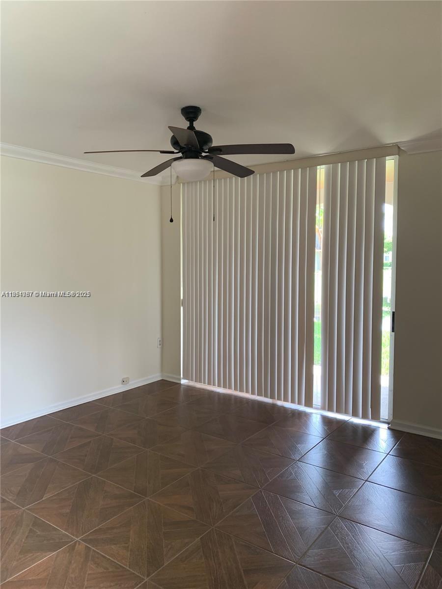 2071 Renaissance Boulevard, Unit 108 Miramar, FL 33025 - Photo 14 of 25 a view of an empty room with a window